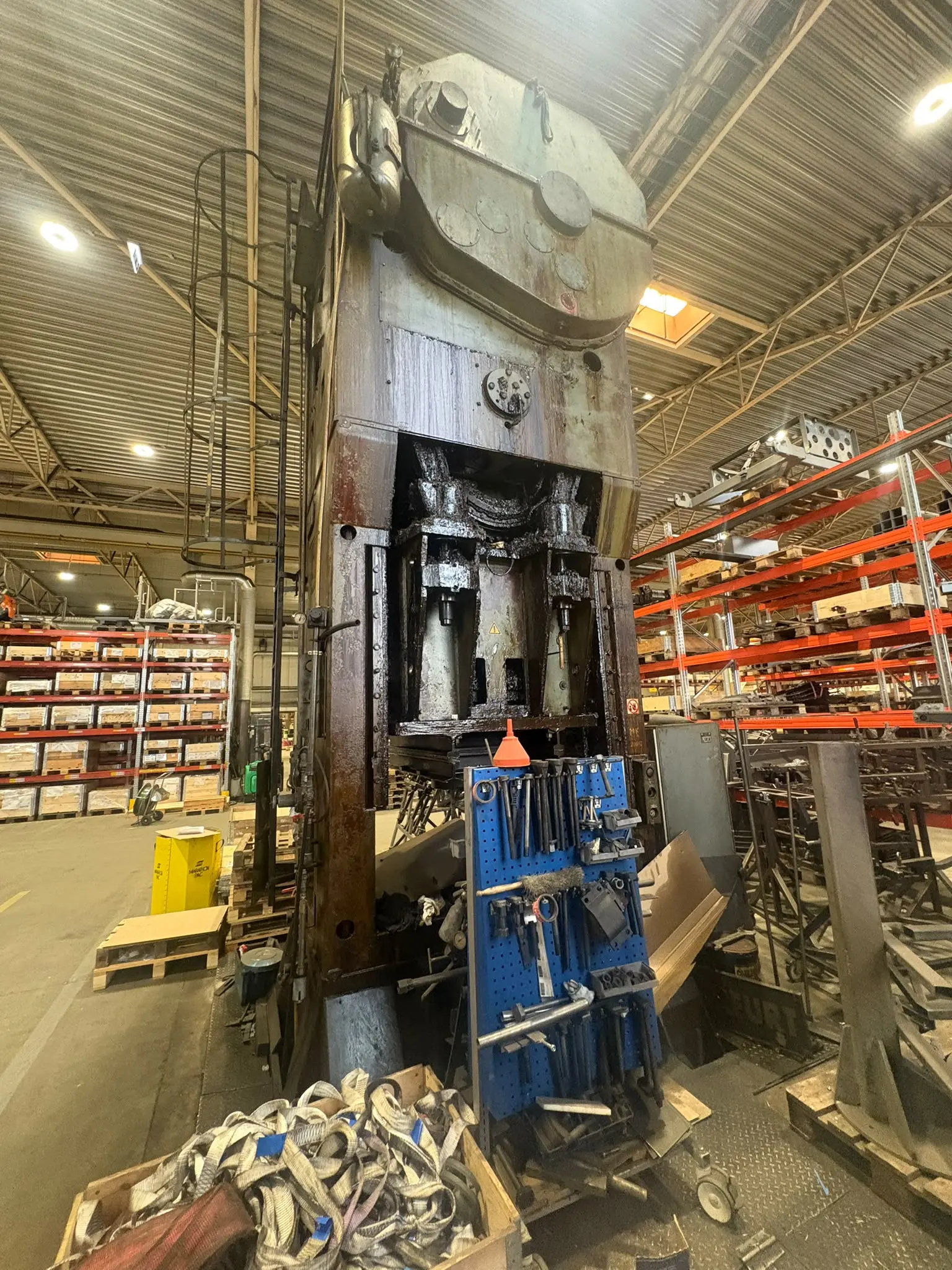 Large industrial press and storage racking in a factory hall