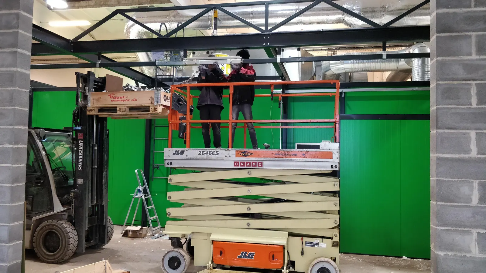 Installing wall panels with a scissor lift
