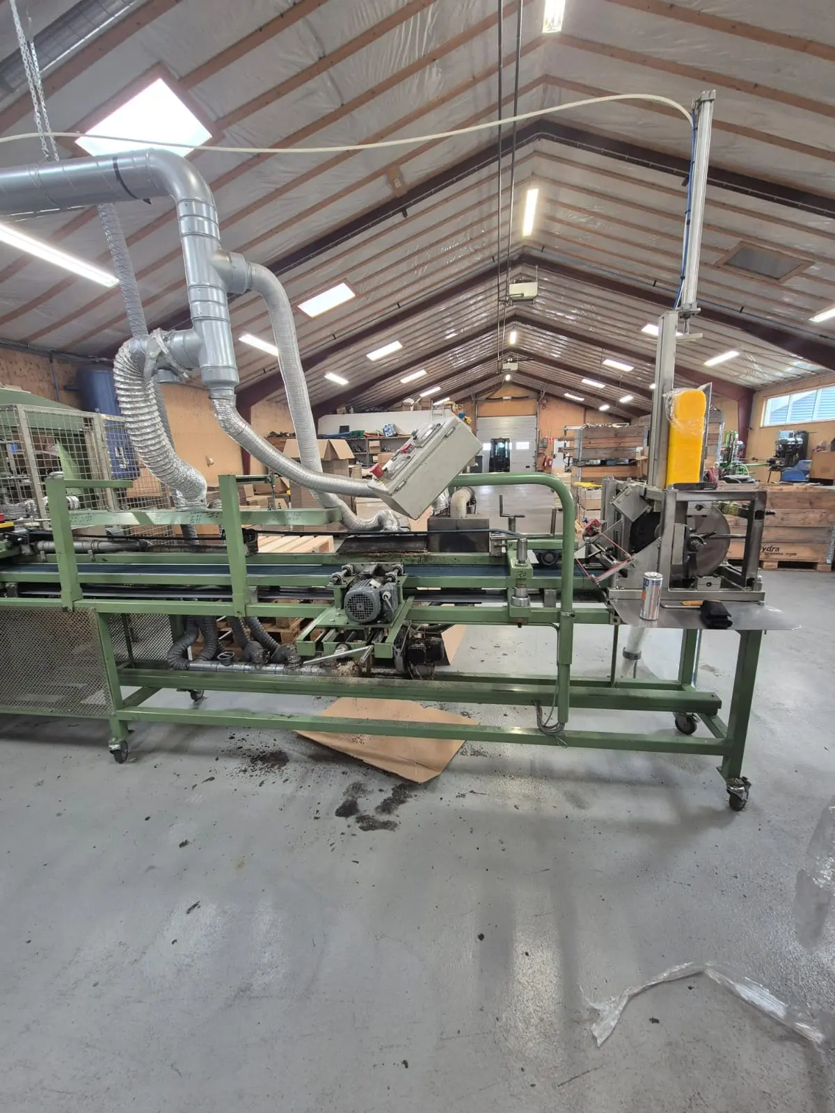 Conveyor and production line machinery in a workshop hall