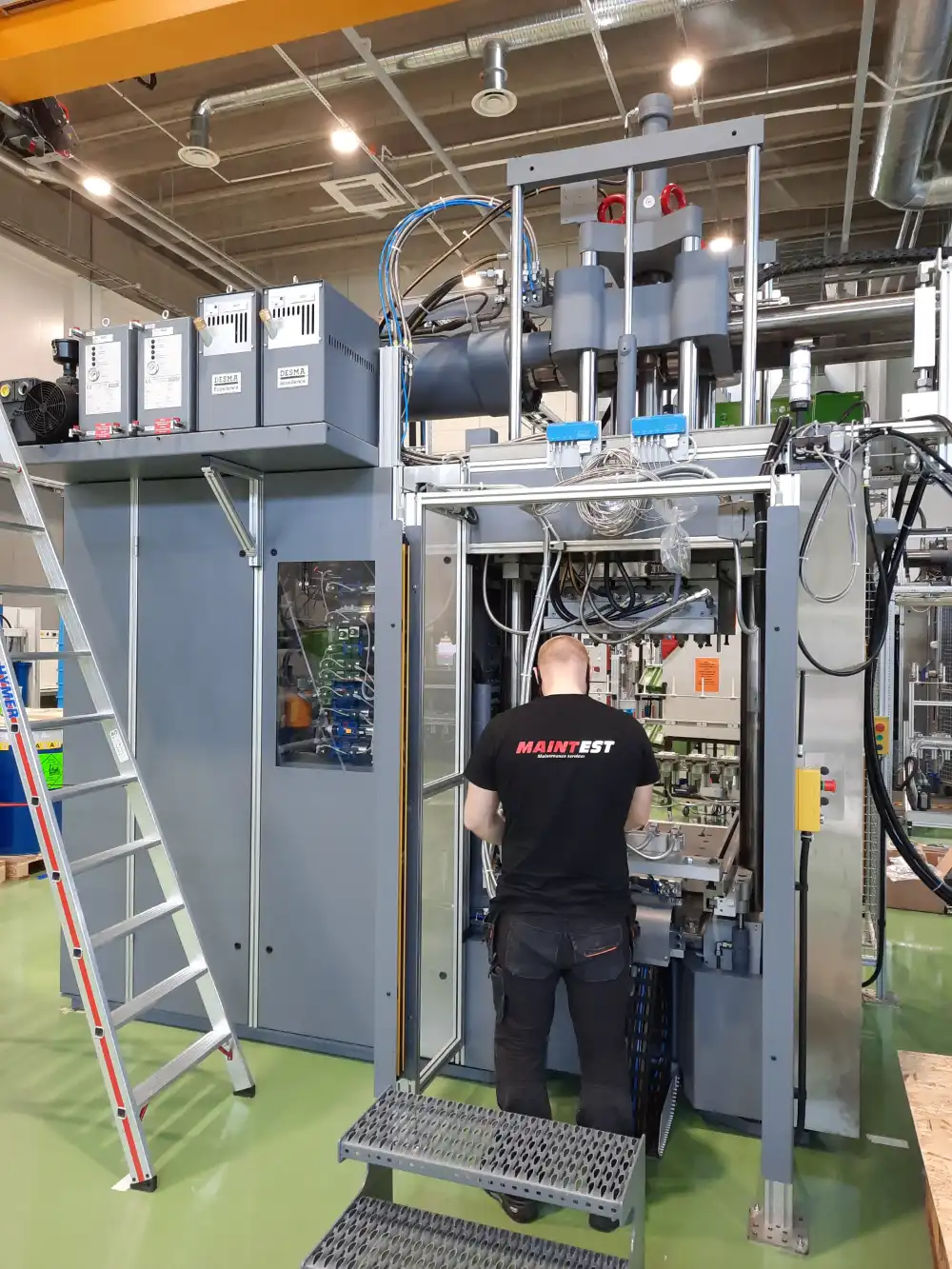 Maintest technician working on a large industrial machine